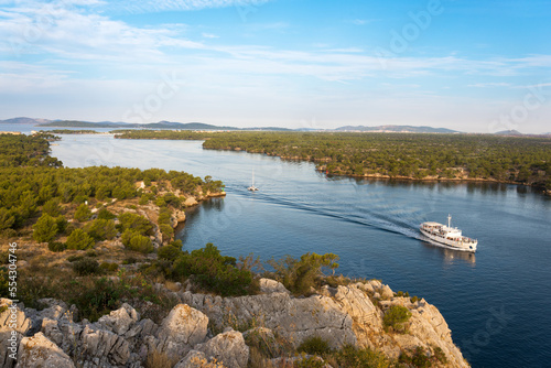 Konstfotografi view of a boat navigating at Sveti ante canal, Šibenik, Croatia