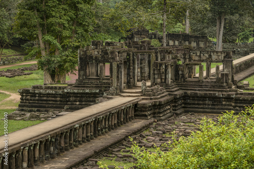 Stone causeway leads to ruined Baphuon temple, Angkor Wat; Siem Reap, Siem Reap Province, Cambodia photo