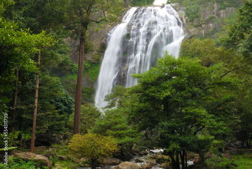 The 300-foot-tall Klong Lan waterfall and surrounding forest.; Khlong Lan National Park, Kamphaeng Phet Province, Thailand. photo