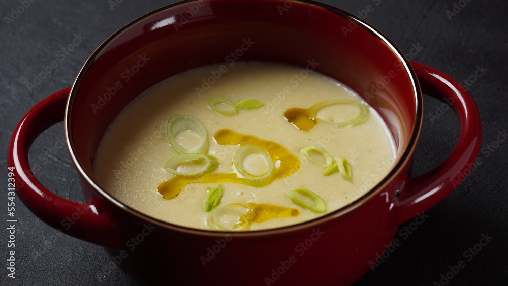 Vichyssoise, classic French chilled cream soup - potato leek, and onion topped with chopped chives Vichyssoise, classic French chilled cream soup - potato leek, and onion topped with chopped chives