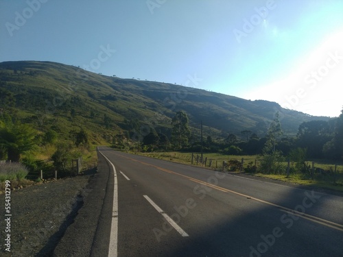 road, highway, mountain, landscape, sky, travel, asphalt, nature, mountains, way, summer, clouds, drive, journey, transportation, street, curve, empty, view, grass, hill, trip, car, country, route