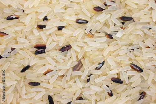 Close view of wild and white rice dry ingredients.