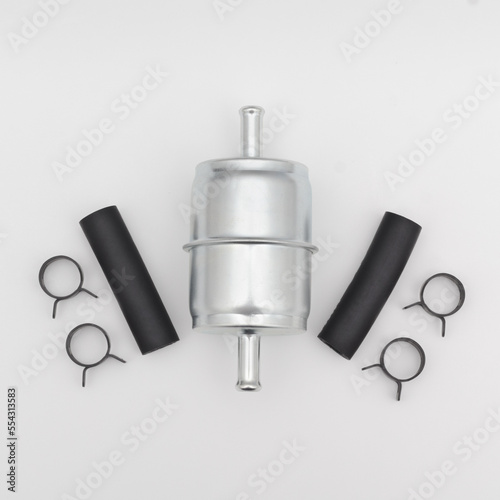 Flat lay view of an inline fuel filter and hardware