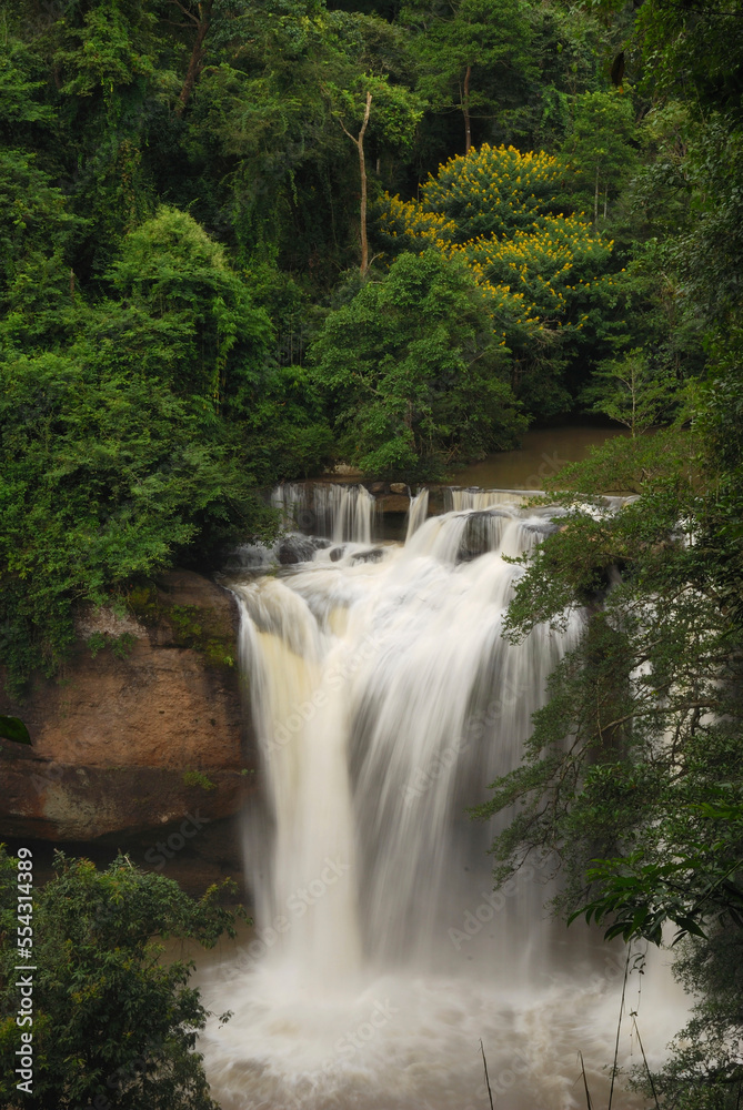 The Haew Suwat Waterfall in a scenic wooded setting.; Khao Yai National Park, Nakhon Ratchasima Province, Thailand. The Haew Suwat Waterfall in a scenic wooded setting.; Khao Yai National Park, Nakhon Ratchasima Province, Thailand.