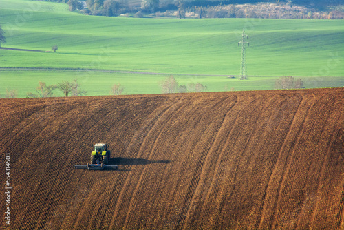 The tractor works the land