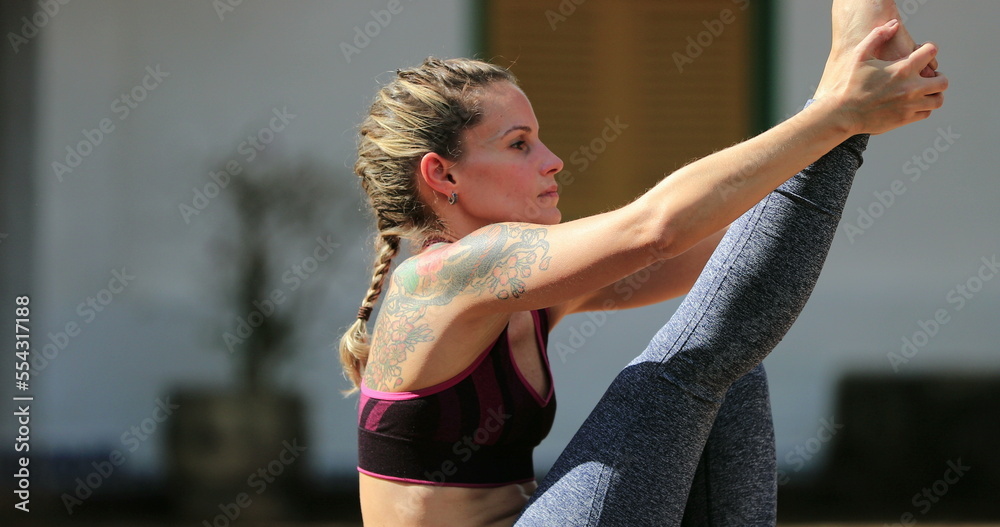 Fototapeta premium Yogi fit woman training Yoga strength asana pose