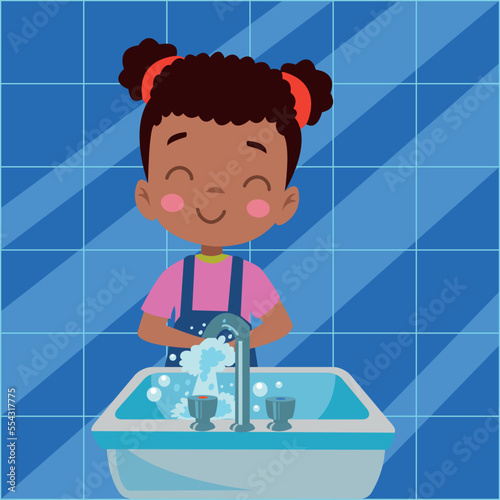 happy cute little kid boy wash hand in sink