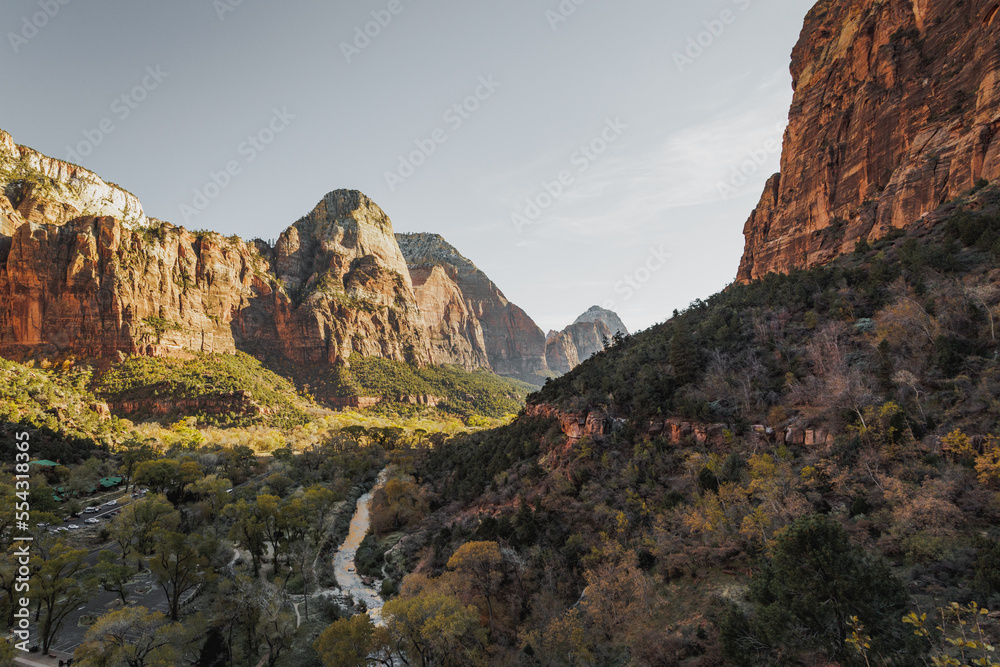 Incredible mountain view landscapes in the valley at Zion National Park in Utah United States. There are amazing colors of orange and yellows at all times of the day.