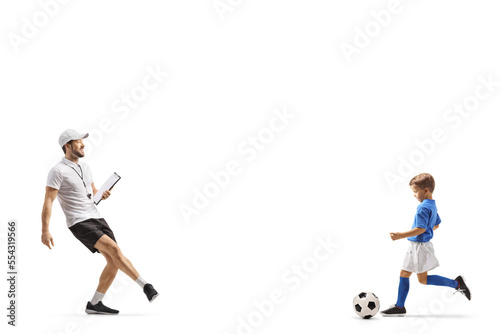 Football coach praticing ball kick with a boy © Ljupco Smokovski