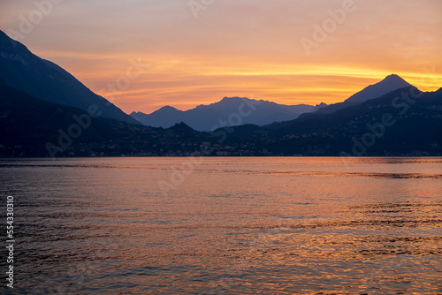 Scenic View Of Lake and Mountains Against Sky During Sunset. Como Lake, Italy