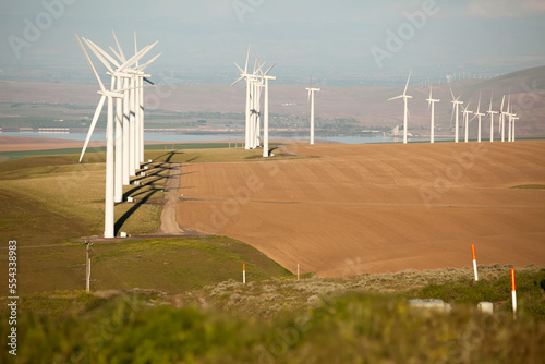 Windmill turbines in a landscape near Jump Off Joe butte, outside Kennewick, Washington.; Jump Off Joe Butte, Kennewick, Washington photo