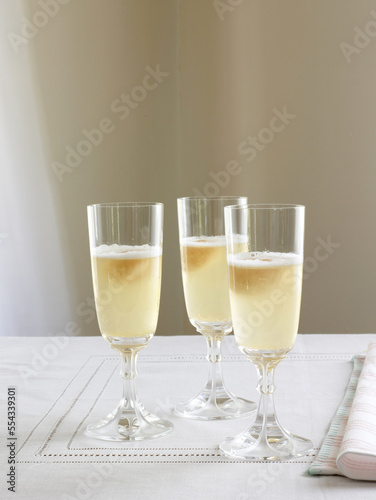 Three glasses of sparkling wine with sorbet.