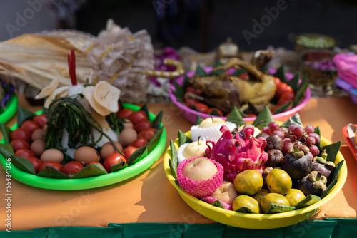Selective focus of various colorful food include fruits, vegetables, and chicken decorated for Siraman in traditional Javanese wedding ritual.