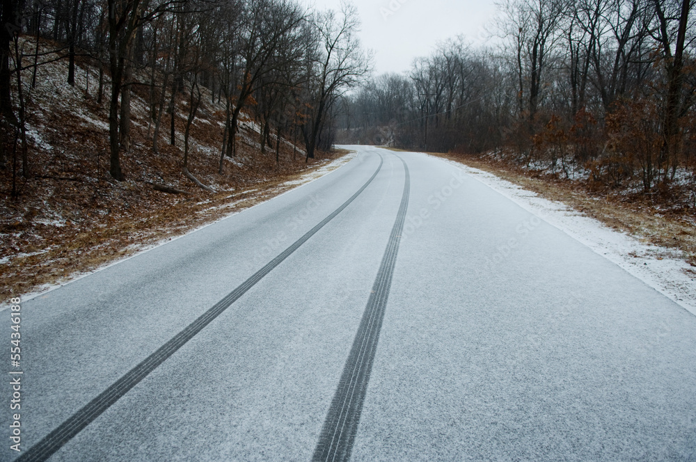 Tire tracks on a snowy road near Eureka, Missouri, USA; Saint Louis, Missouri, United States of America Tire tracks on a snowy road near Eureka, Missouri, USA; Saint Louis, Missouri, United States of America