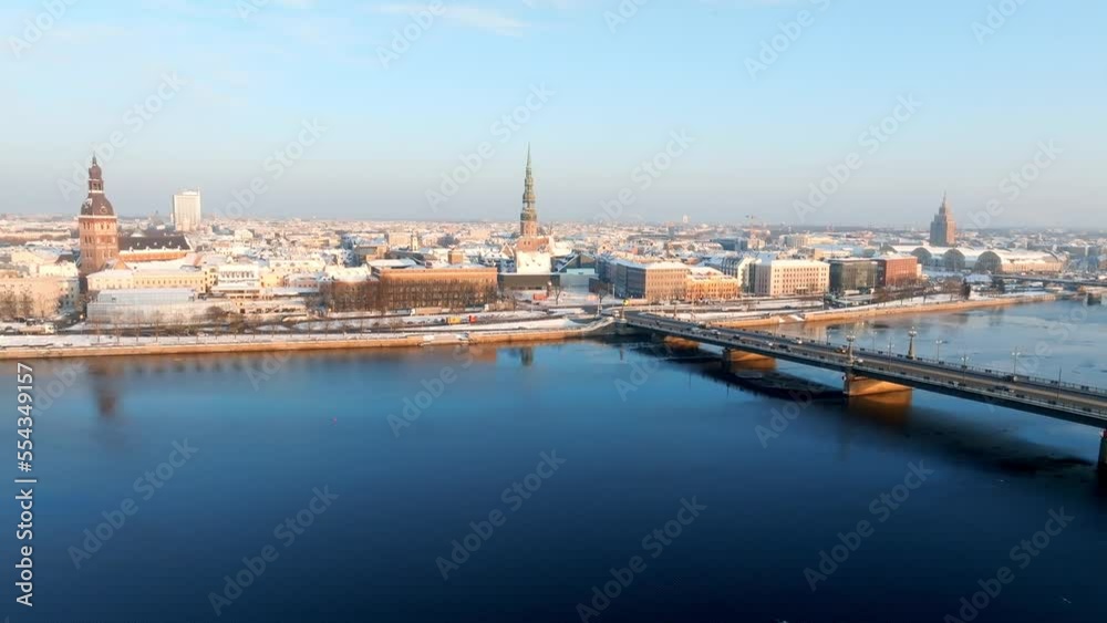 Beautiful sunset over winter Riga, Latvia. Aerial view of the old town near river Daugava. Winter in Latvia. Beautiful sunset over winter Riga, Latvia. Aerial view of the old town near river Daugava. Winter in Latvia.