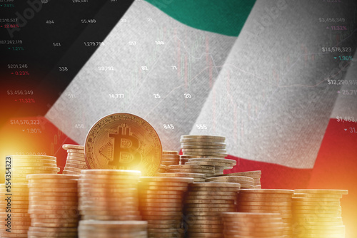 Kuwait flag and big amount of golden bitcoin coins and trading platform chart. Crypto currency concept photo