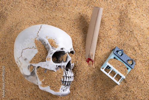 Death Skull under sand beach isolated with last will inheritance or treasure map. Finance Property Contract or letter Lawyer to family. Insurance dead concept, copy space photo