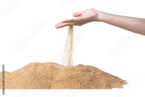 Hand releasing dropping sand. Fine Sand flowing pouring through fingers against white background. Summer beach holiday vacation and time passing concept. Isolated high speed shutter #554356110