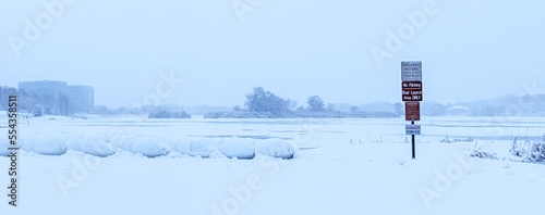 Snow covered forests, land and lakes in a brutal winter	 photo