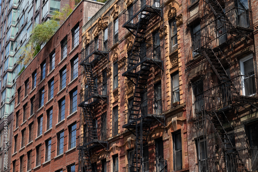 Row of Beautiful Old Brick Apartment Buildings with Fire Escapes on the Lower East Side of New York City
