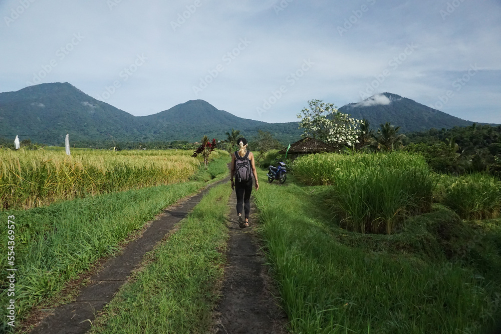 A woman walking around Tegalalang Rice field in Bali, Indonesia.
