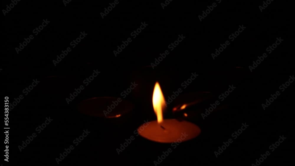 Candle lighting in the dark, selective focus Candle lighting in the dark, selective focus