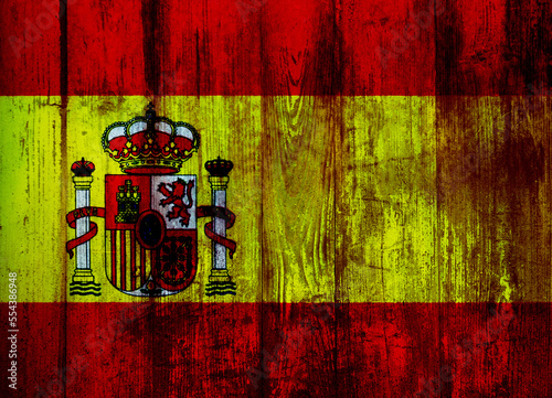 Spanish flag on old wood plank