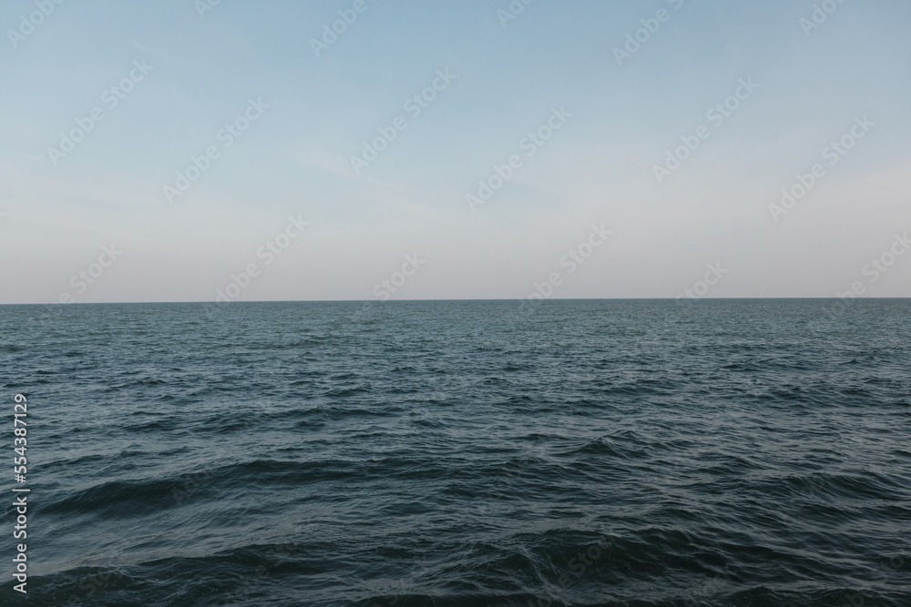 blue ocean waves and blue sky background.