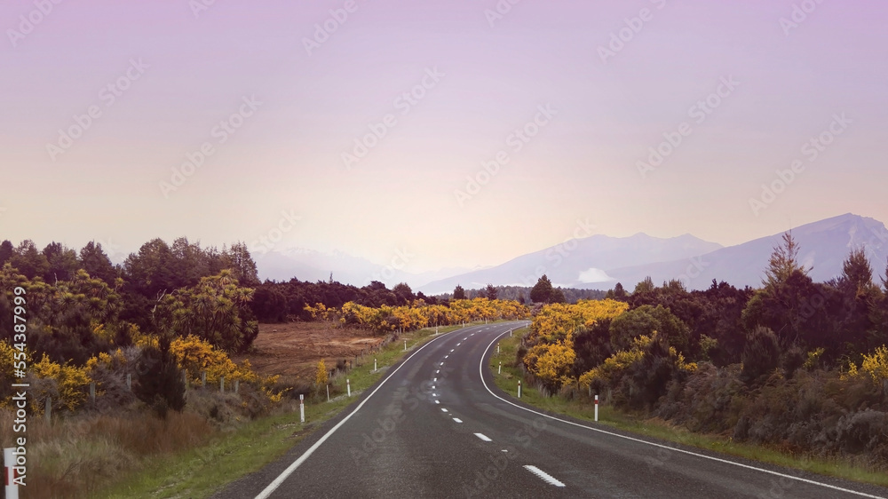 The Road trip view of  travel with mountain view of autumn scene and  foggy in the morning with sunrise sky scene at fiordland national park