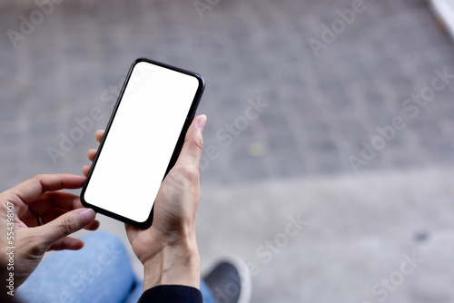 cell phone blank white screen mockup.hand holding texting using mobile on desk at office.background empty space for advertise.work people contact marketing business,technology