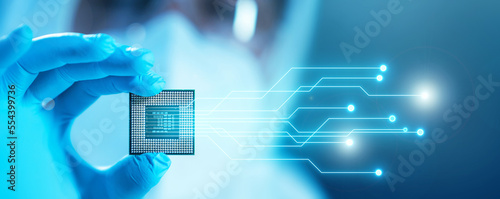 Close-up of Professional Scientist Holding a Modern Microprocessor Chip in Hand. Scientific Laboratory, Research and Development of Microelectronics and Processors. Computer Technology and Equipment.