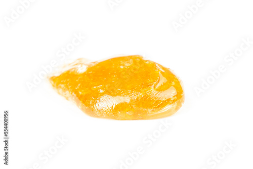 gold cannabis resin extract isolate on white background,yellow dab smear