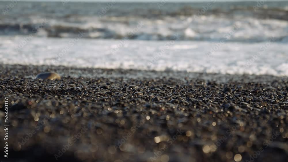 Pebbles on black beach with tide Pebbles on black beach with tide