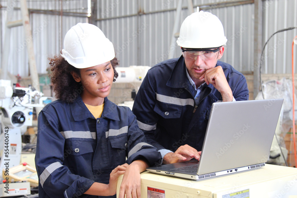 Engineers use laptops to design and control robots. Engineers use laptops to design and control robots.