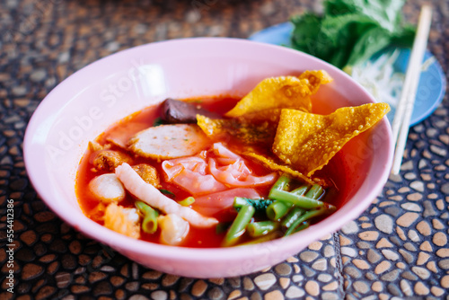 Close up of noodle in pink broth ( Yentafo ) - delicious and healthy street food in Thailand