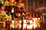 Christmas decoration and gifts on a shining table. 