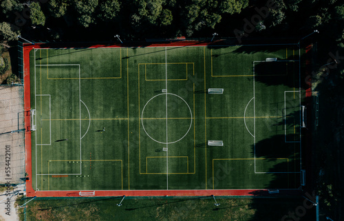 Drone view of green soccer playground 
