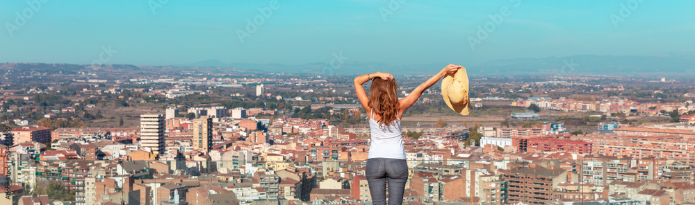 Happy woman in front of urban,  city landscape,  skyline