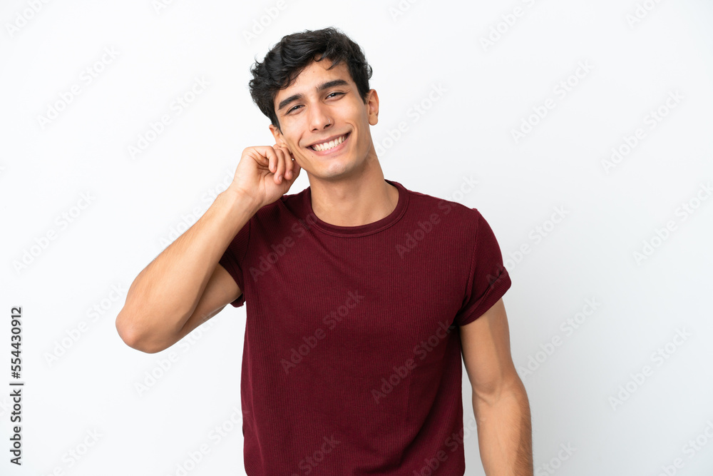 Young Argentinian man isolated on white background laughing Young Argentinian man isolated on white background laughing