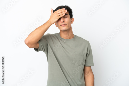 Young Argentinian man isolated on white background covering eyes by hands. Do not want to see something © luismolinero