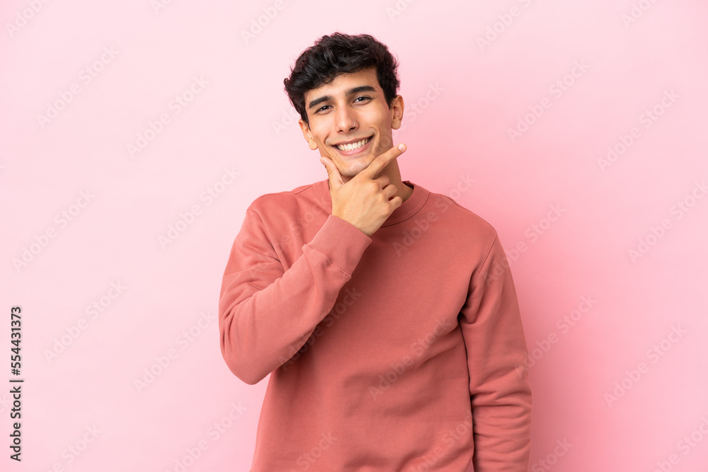 Young Argentinian man isolated on pink background happy and smiling Young Argentinian man isolated on pink background happy and smiling