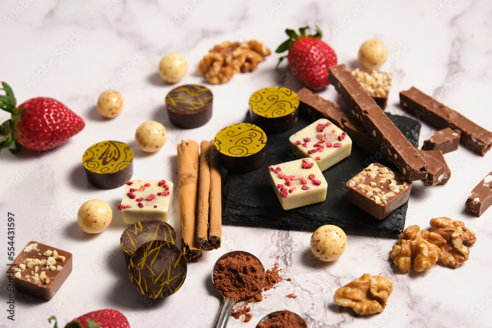 a variety of chocolates on a light background a variety of chocolates on a light background