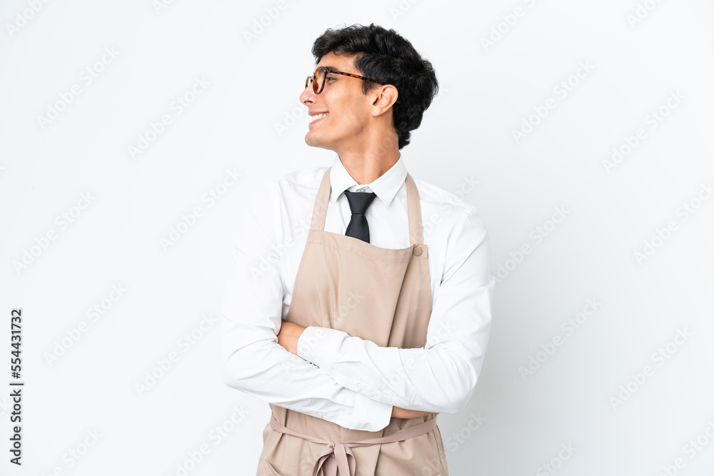 Restaurant Argentinian waiter isolated on white background looking side