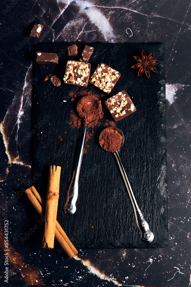 a variety of chocolates on a dark background