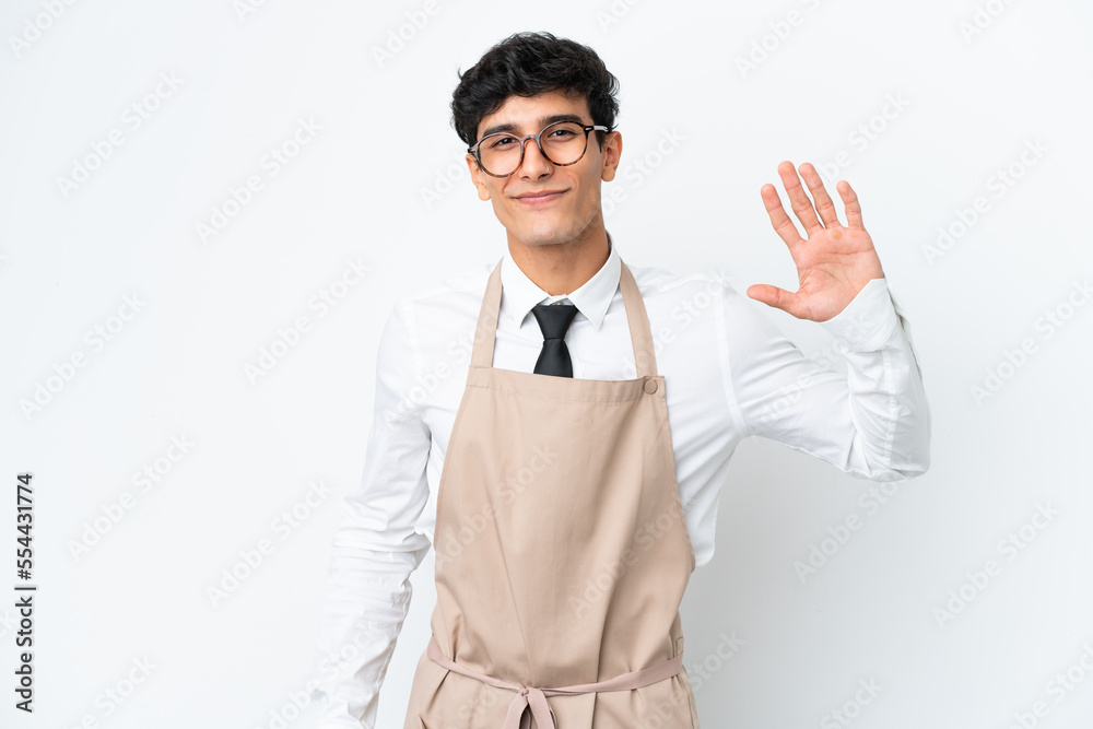 Restaurant Argentinian waiter isolated on white background saluting with hand with happy expression Restaurant Argentinian waiter isolated on white background saluting with hand with happy expression