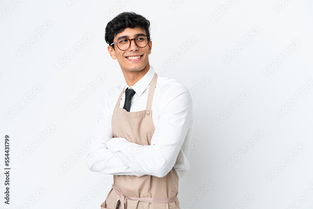 Restaurant Argentinian waiter isolated on white background with arms crossed and happy Restaurant Argentinian waiter isolated on white background with arms crossed and happy
