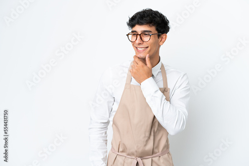 Restaurant Argentinian waiter isolated on white background looking to the side