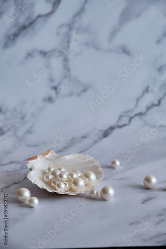 pearls in a shell on a marble background