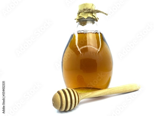 Vintage Old Honey Bee Bottle Packaging Design Ideas, Dipper and wood spoon, pure natural wild honey issues, health benefits for cancer, diabetes, organic acids and enzymes