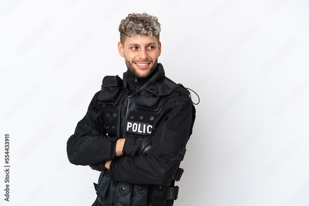 SWAT caucasian man isolated on white background with arms crossed and happy SWAT caucasian man isolated on white background with arms crossed and happy